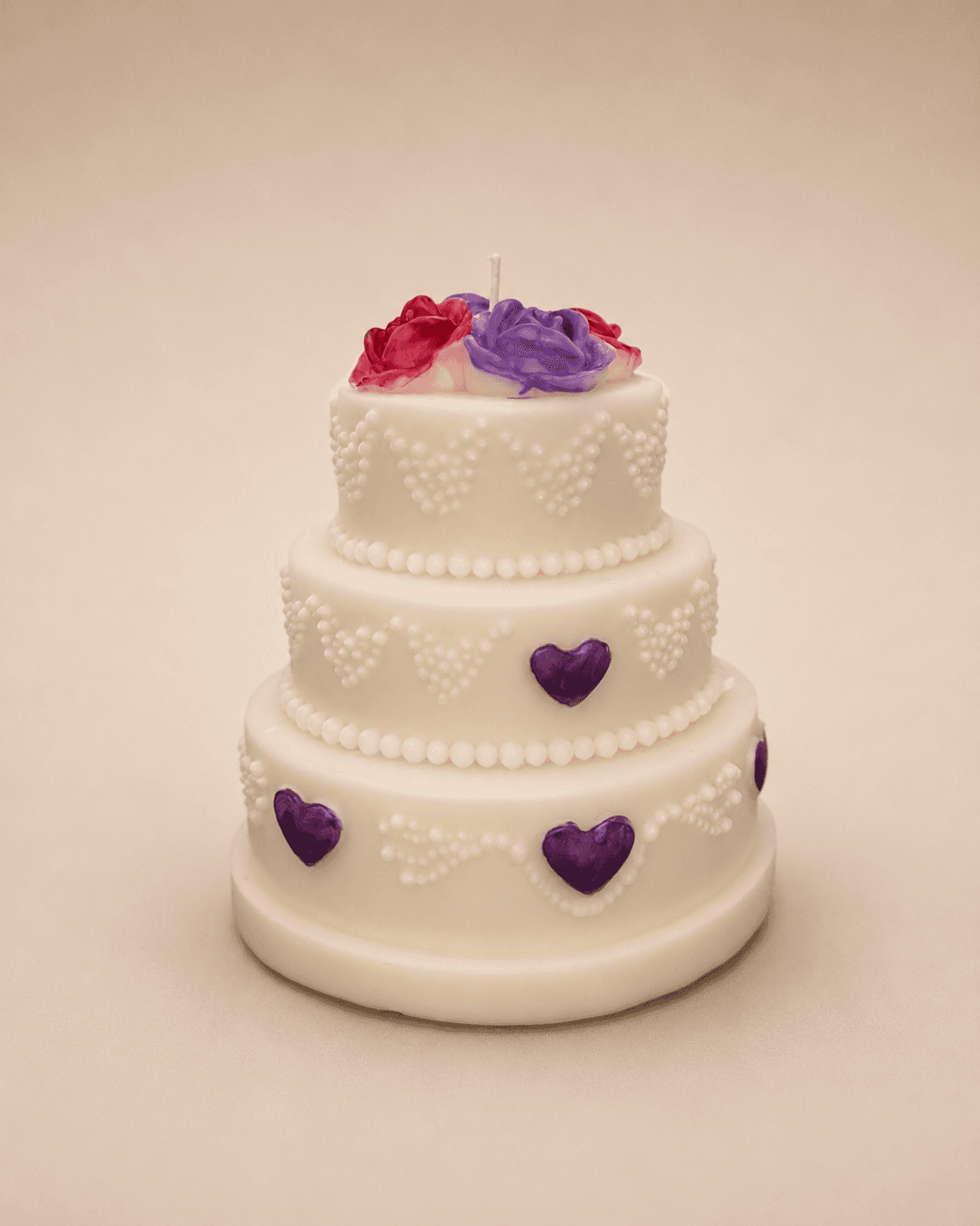 Custom three-tier wedding cake candle with hearts and roses