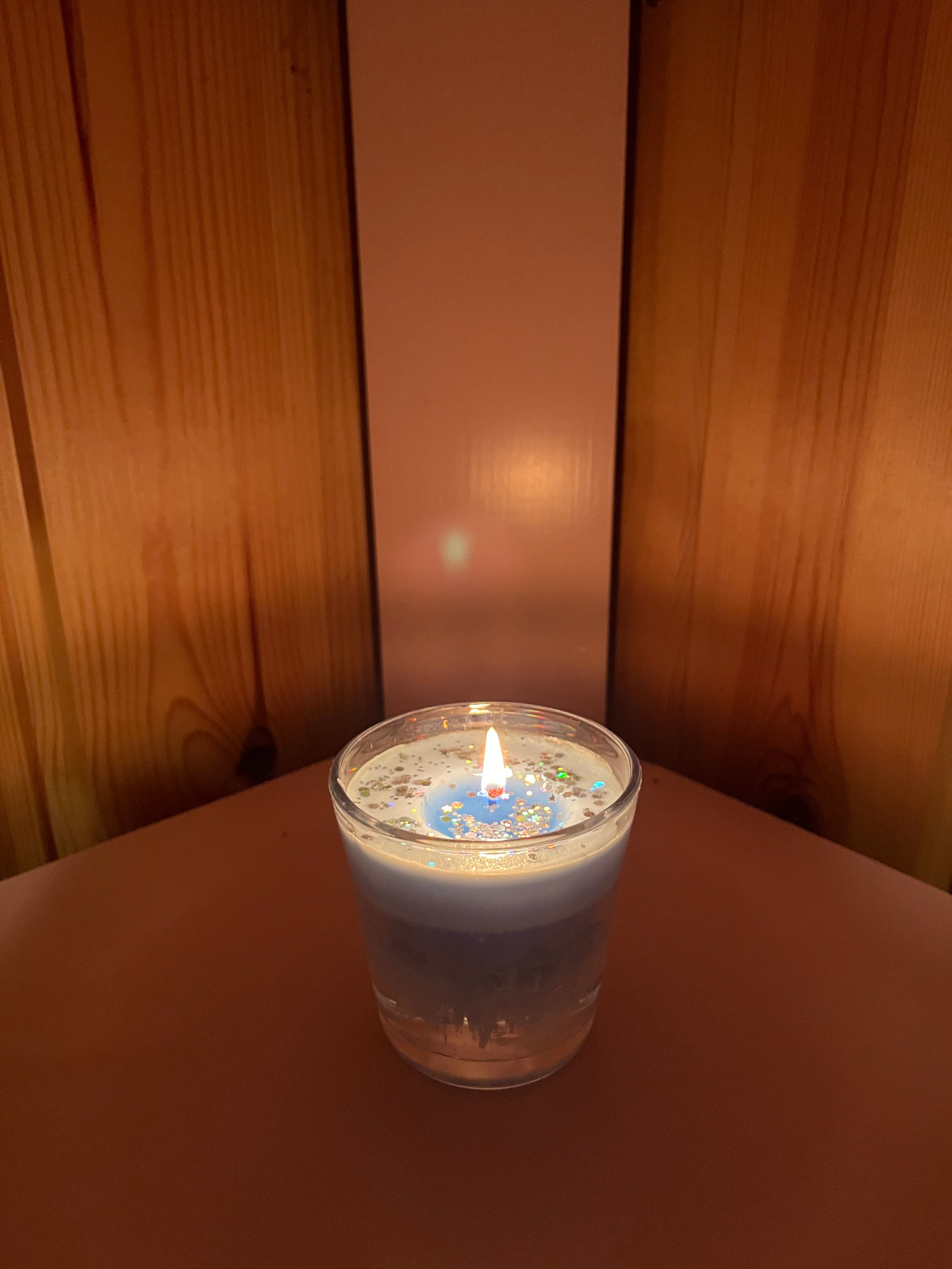 A customer’s candle lit in a sauna