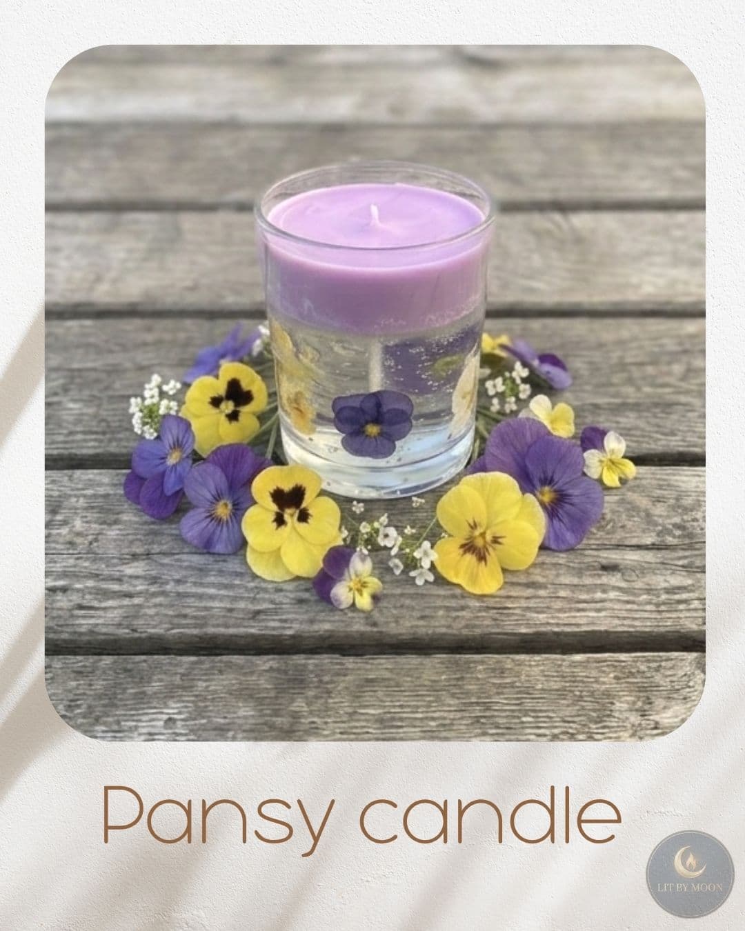 Real pressed pansy flowers embedded in clear gel wax — nature preserved in light.